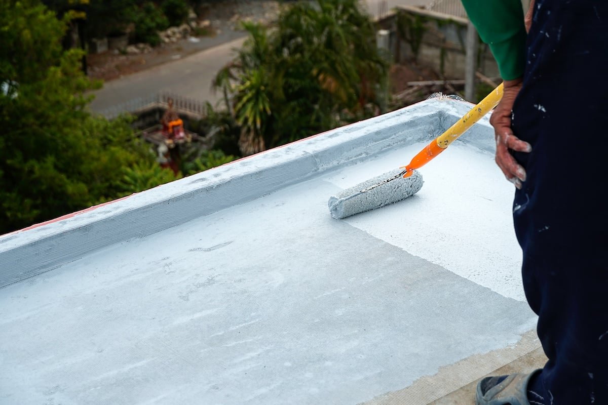Reflective roof coating · application in progress