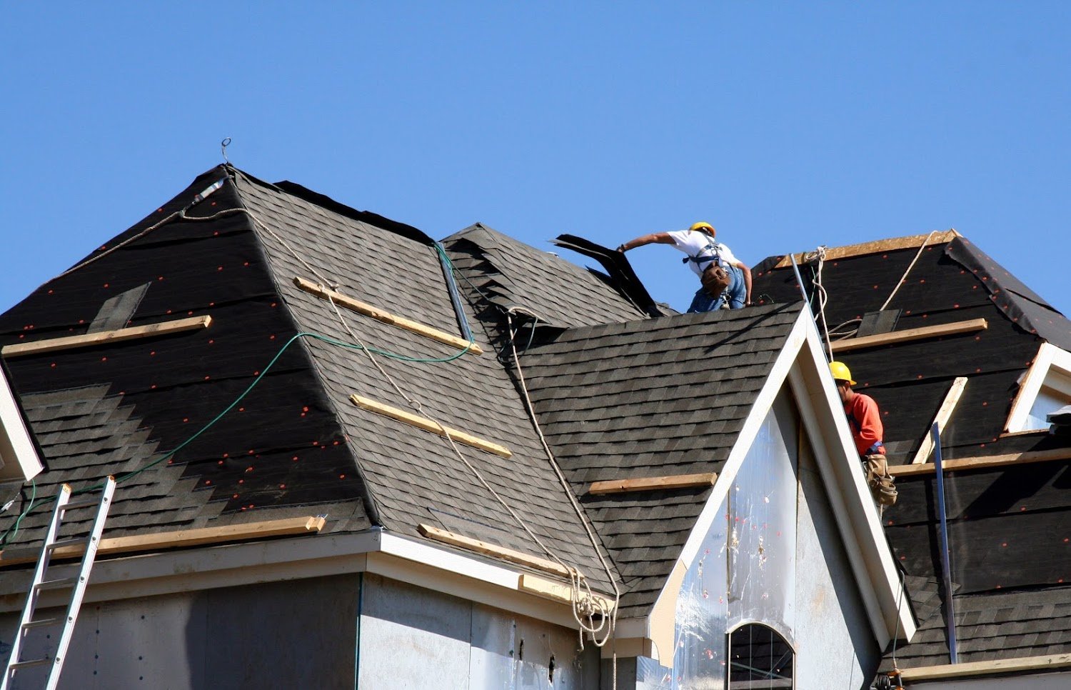 2400 × 1400 · crew mid-job on a Southern California roof or ADU framing